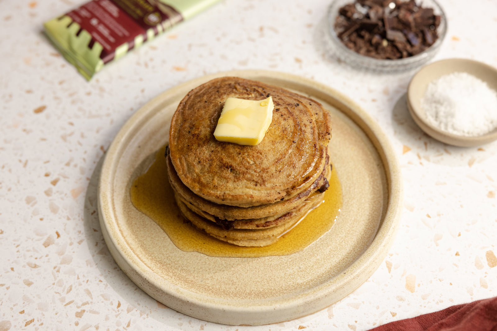 stack-of-pancakes-with-butter-and-syrup-on-plate